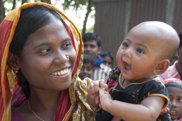 Ripa (25), and her child Aysa (4 Months) posed for photograph while they come for vaccination at Tarapur Saner Chor, Astadhor Union, Mymensingh, Bangladesh on 21 December 2009. Bangladesh Government runs immunization project in Mymensingh supported by UNICEF.