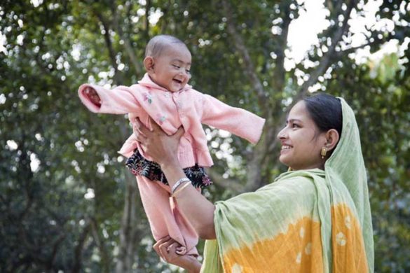 A Mather is posed for photograph with her child at Unicef assisted Expanded Programme Immunisation, during Measles Vaccination Campaign at Ghurkha, Raygonj, Sirajgonj, Bangladesh on 15 February 2010.